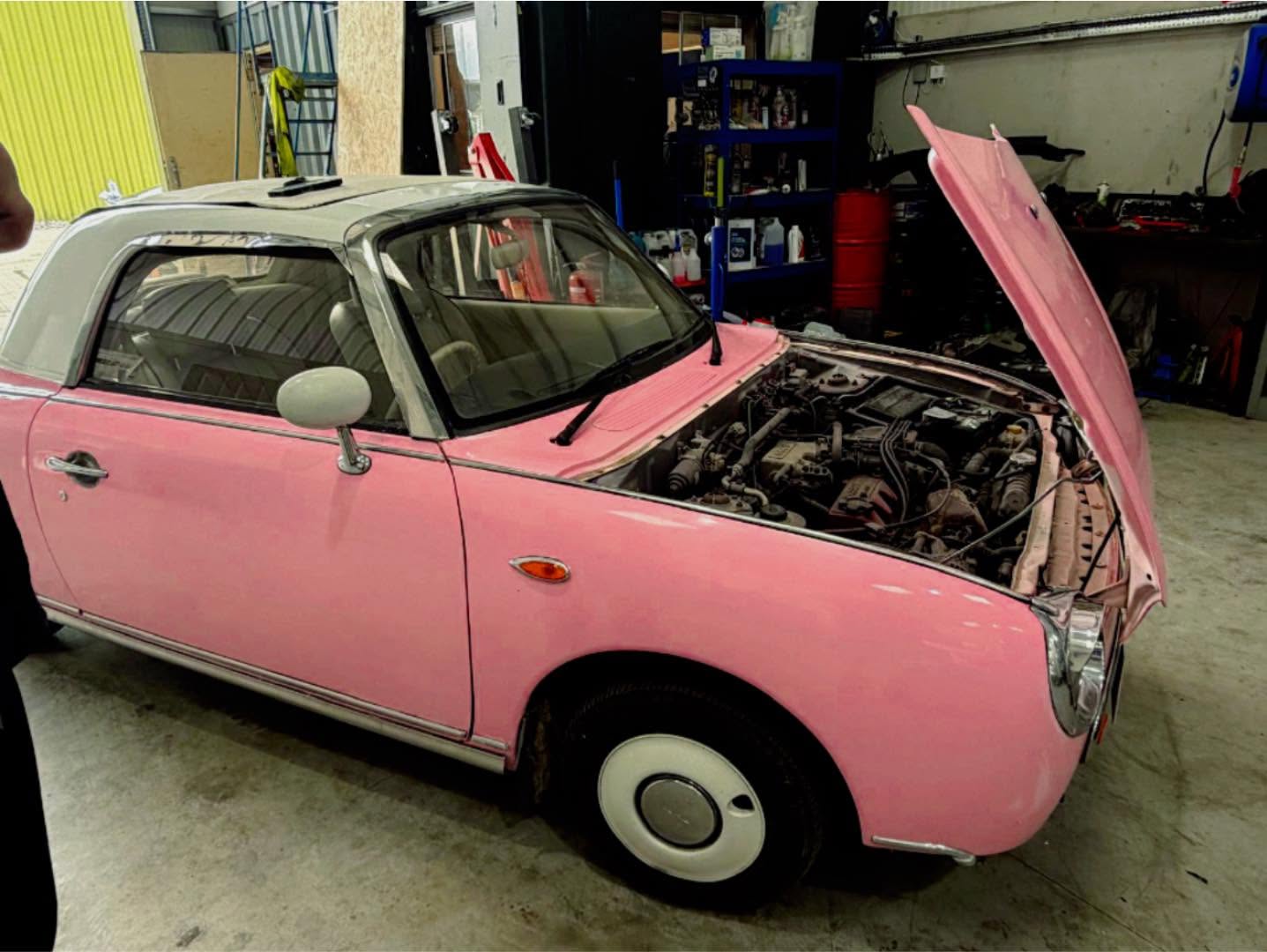 Car undergoing diagnostics and servicing in the Knight's workshop